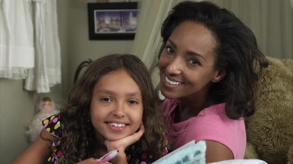 Slow motion of mother and daughter smiling alt