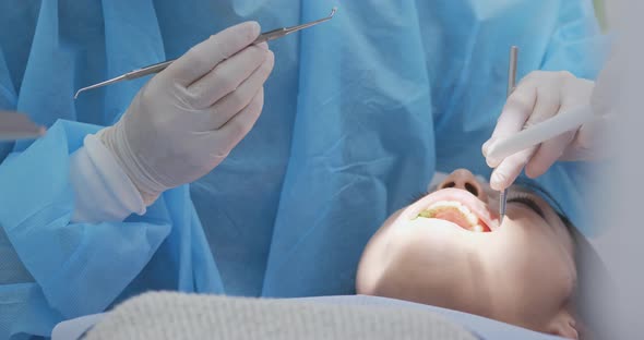 Woman having dental check up at dental clinic alt