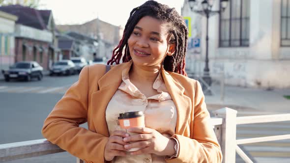 Smiling Attractive Young African American Woman Standing in the Street