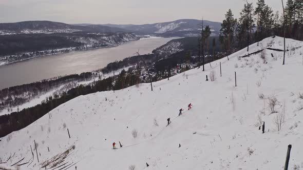 A Group of Skiers Climbing Up the Mountain