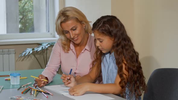 Mature Female Teacher Enjoying Working with Her Little Student at School 1080p alt