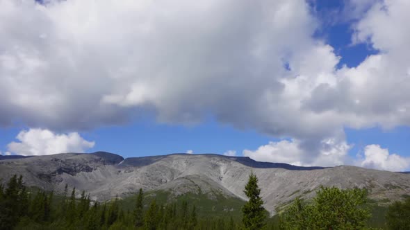 Gorgeous View of Cloudy Sky Above the Khibiny Mountains and Dense Forest