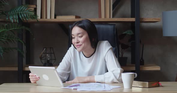 Asia Freelance Business Women Casual Wear Using Tablet Working Call Video Conference with Customer alt