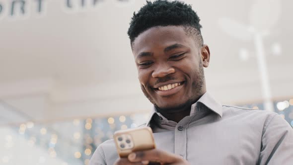 Closeup Young Happy Man Looking at Phone Screen Smiling Enjoying Distance Communication Reads alt