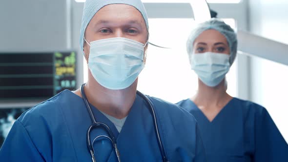 Professional medical doctors working in emergency medicine. Portrait of surgeon and the nurse. alt