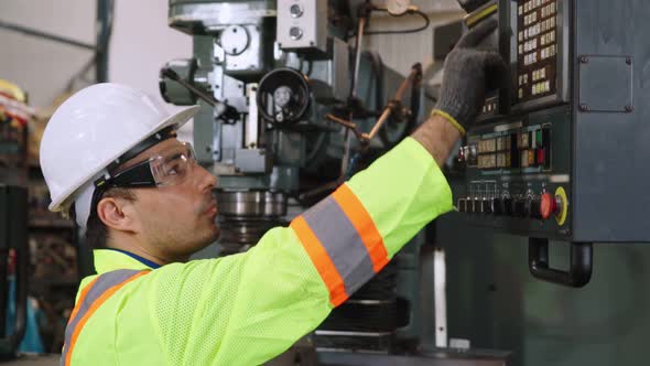 Smart Factory Worker Using Machine in Factory Workshop alt