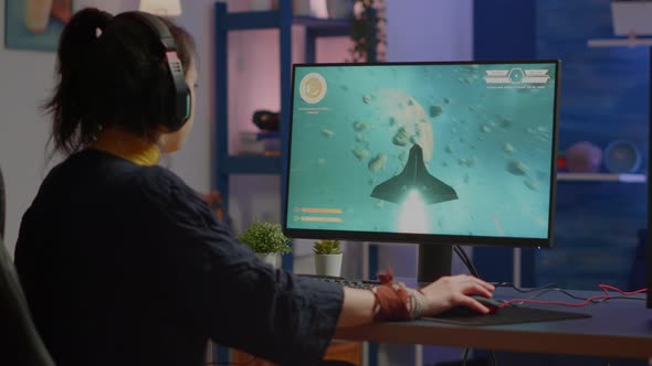 Professional Esports Woman Gamer Wining Playing on RGB Powerful Computer alt