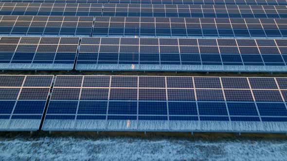 Close Up Drone View of Solar Panels Stand in a Row in the Fields Power Ecology Innovation Nature alt