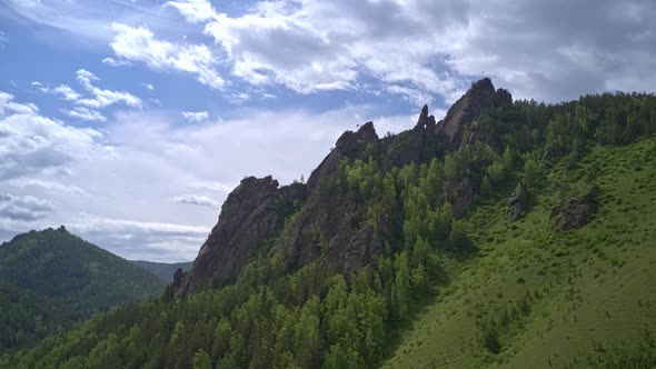 Aerial Hyperlapse of Clouds Over the Takmak Rock in the Russian Stolby Nature Reserve