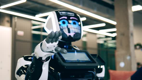 Modern Robot is Touching a Hand of a Person in a Business Suit alt