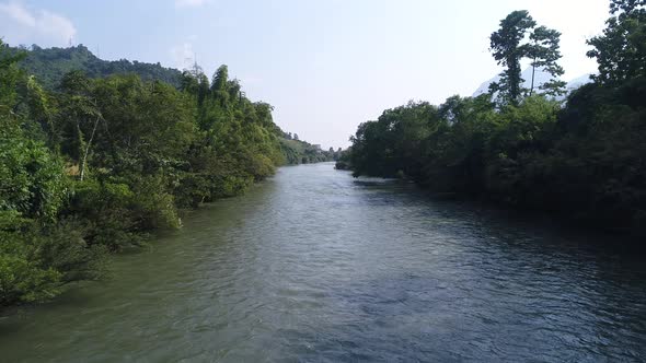 River near town of Vang Vieng in Laos seen from the sky alt