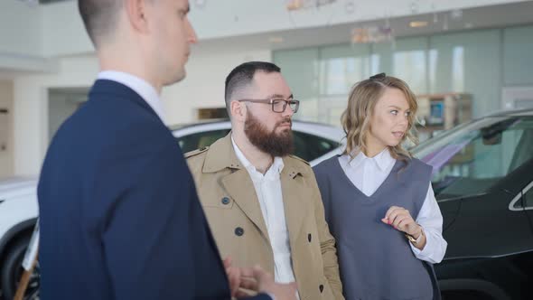 Sales Manager in a Car Dealership Serves a Married Couple alt