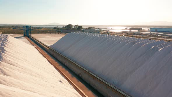 Aerial View of Industrial Extraction of Salt in the Desert, Pile of Salt. alt