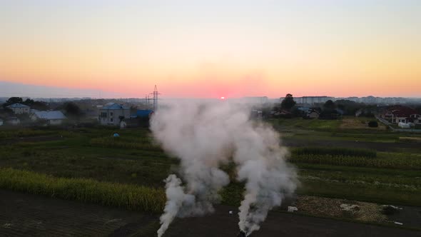 Aerial View of Agricultural Waste Bonfires From Dry Grass and Straw Stubble Burning with Thick Smoke alt