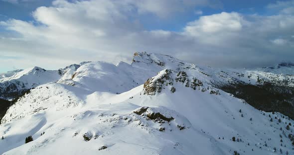 Backward Aerial From Snowy Mounts at Valparola Pass