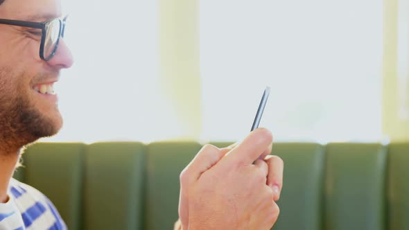 Man using mobile phone 4k alt