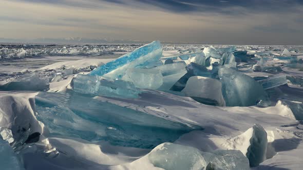 Blue Broken Ice Floe on Frozen Baikal Lake