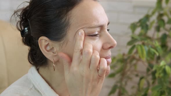 Sad female with poor eyesight.  alt