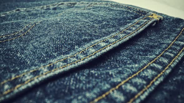 Extreme Detailed of Blue Denim Jeans Texture in Dolly Shot Over Cloth Surface alt