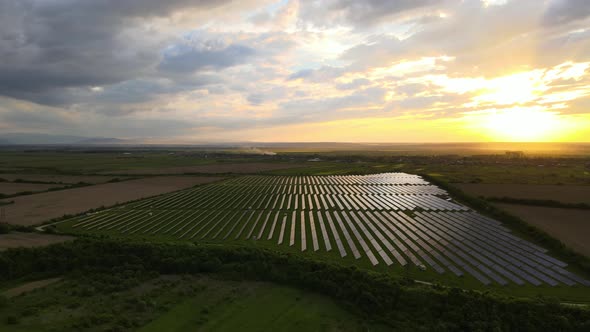 Aerial View of Big Sustainable Electric Power Plant with Rows of Solar Photovoltaic Panels for alt