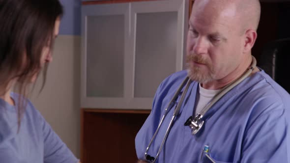 Male nurse check patient's blood pressure