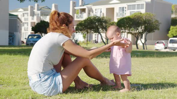 Happy Moms and Baby on a Walk in the Park alt