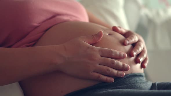 Happy Pregnant Woman and Expecting Baby at Home alt