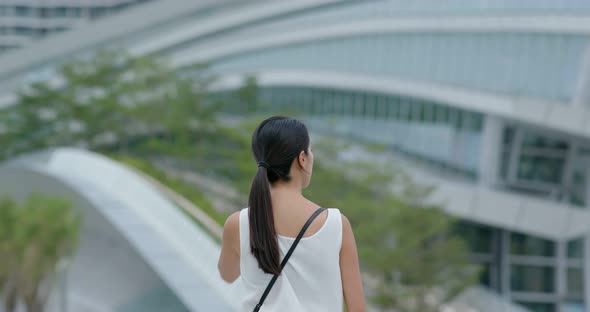 Woman look around in the station alt