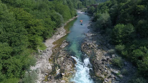 Two rafting boats approaching the rapids on a river