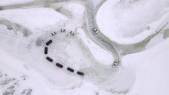 Drone Aerial View of Training Circuit on Frozen Lake with Sport Cars Training on It Before alt