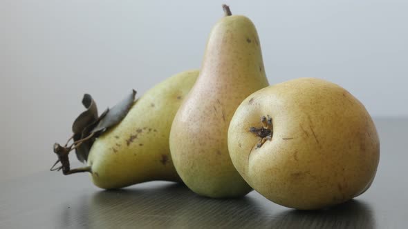 Yellow fruit from genus Pyrus slow tilt 4K 2160p UltraHD footage - Small group of tasty pears  3840X