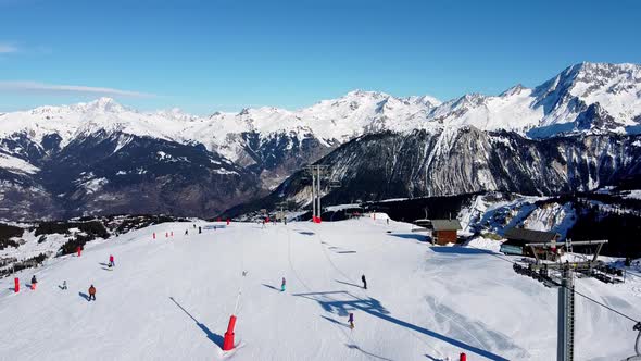 Aerial View of the Alps Mountains in France. Mountain Tops Covered in Snow. Alpine Ski Facilities