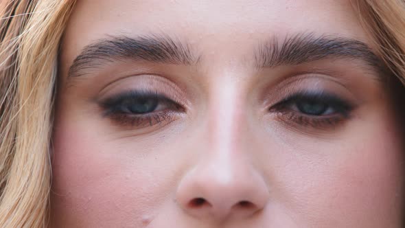 Close Up of Female Face Young Caucasian Girl Looking at Camera with Beautiful Blue Eyes Attractive alt