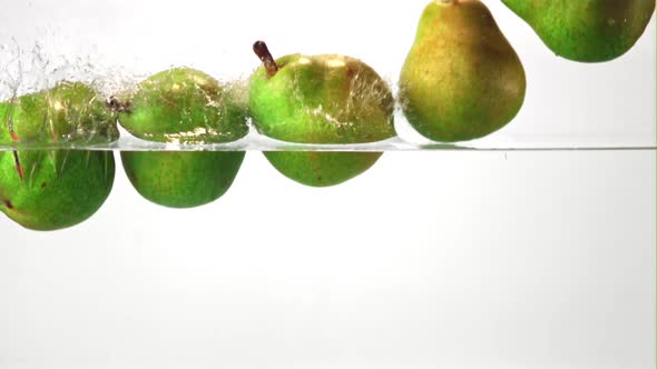 Super Slow Motion Pears Fall Into the Water with Air Bubbles alt