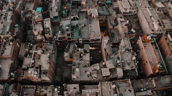 India, Delhi city center slums roofs aerial 4k drone footage, evening dusk alt