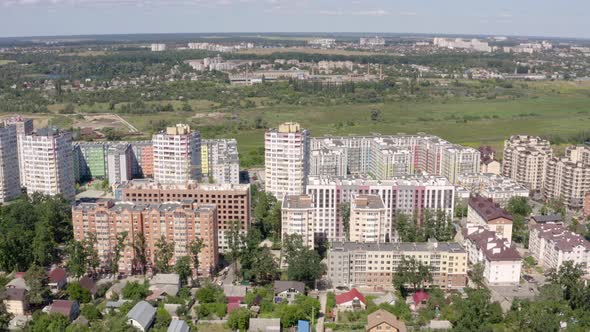 Green Cityscape with Blue Skyline on Summer Sunny Day