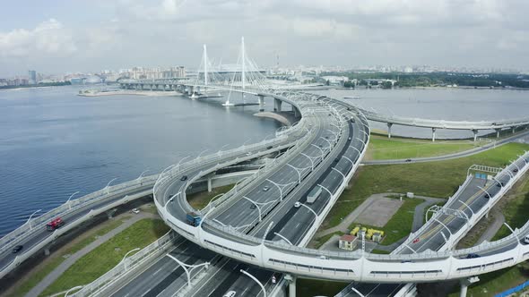 Aerial View of Saint Petersburg Landscape Motorway with Driving Cars and Bridge Over River Spbd alt