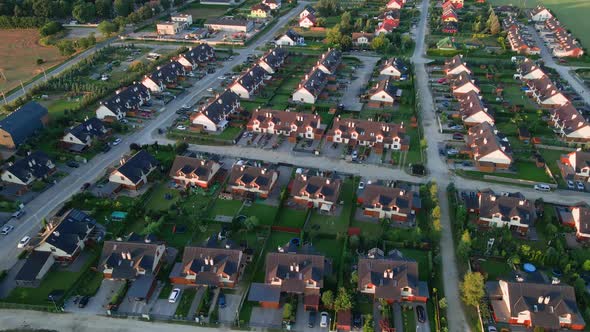 Aerial View of European Suburban Neighborhood at Sunset alt