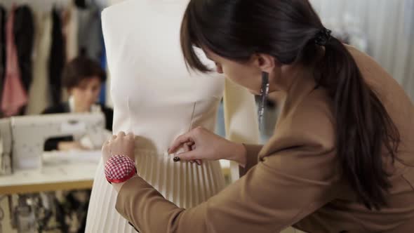 Creative Fashion Designers are Working Together in the Tailor Studio alt
