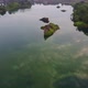 Aerial fly over quarry pool with clear water reflection - VideoHive Item for Sale