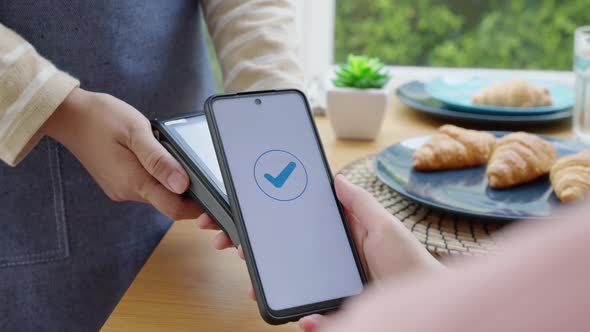 Mobile phone contactless paying cashless e-wallet digital payment. alt