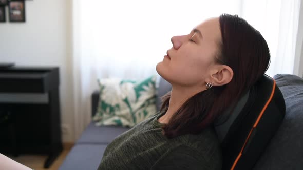 Woman relaxing on massage chair