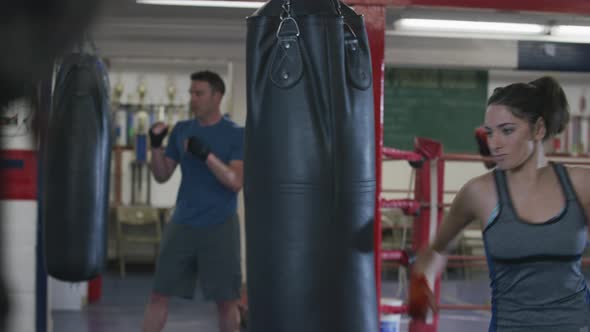 Woman working out at boxing gym