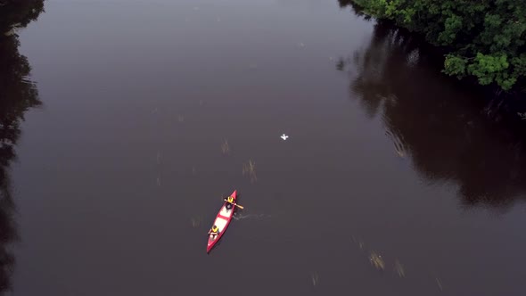 The Aerial View of the Canoe on the River in Estonia
