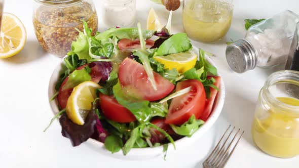 Healthy spring salad with various dressings