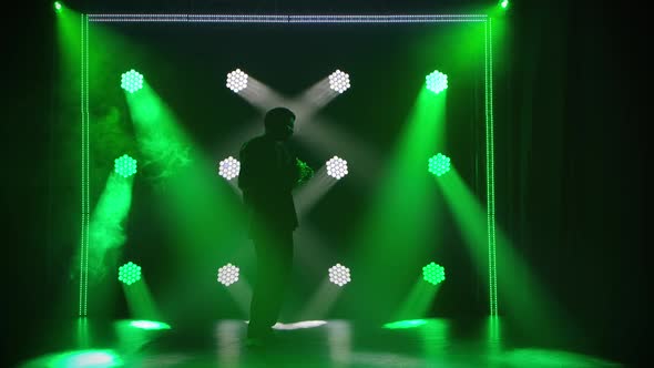 An Ethnic Musician Plays the African Rhythm Instrument Shekere and Dances To the Rhythm of the Music alt