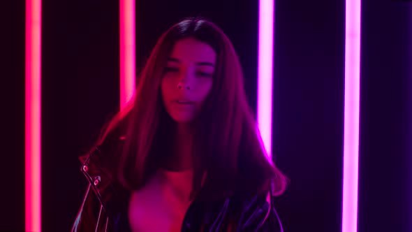 Portrait of Young Smiling Happy Beautiful Woman Dancing and Enjoying Playing Music. Close Up. Slow alt