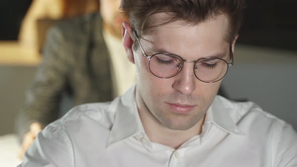 The Face of a Man with Glasses in Closeup