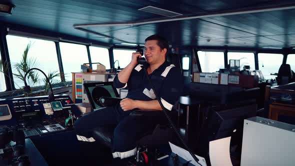 Marine Deck Officer or Seaman on Navigation Bridge of Vessel or Ship alt