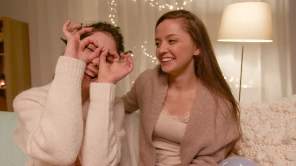 Female Bloggers Recording Home Video alt